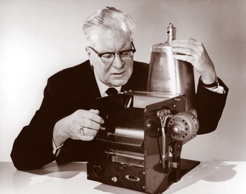 Chester Carlson - Vintage and modern photocopier representing the evolution of photocopying technology.