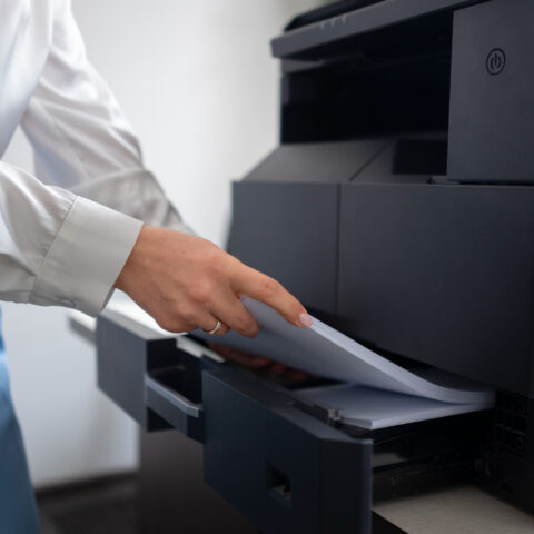 Modern scanner and photocopier in a business setting.