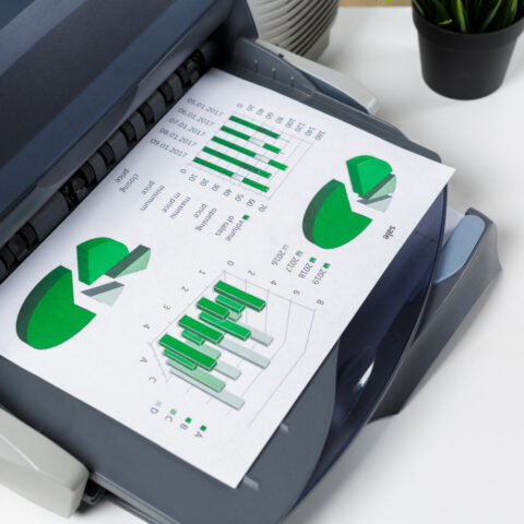 A3 and A4 multifunction printers in an office.