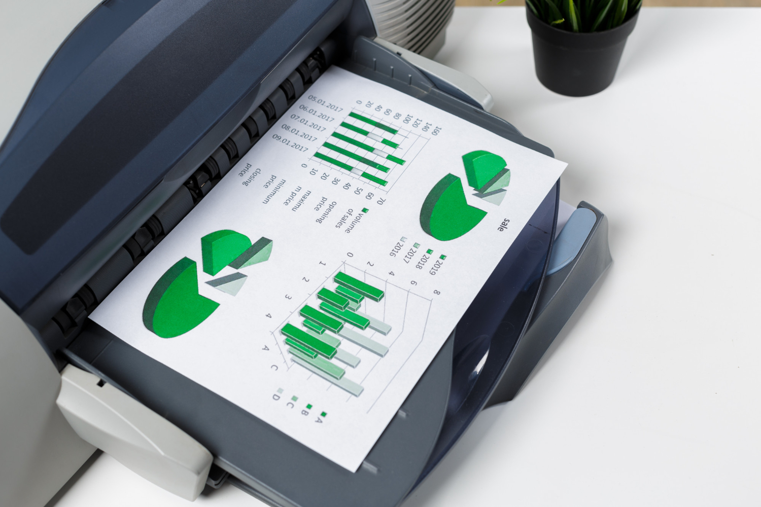 A3 and A4 multifunction printers in an office.