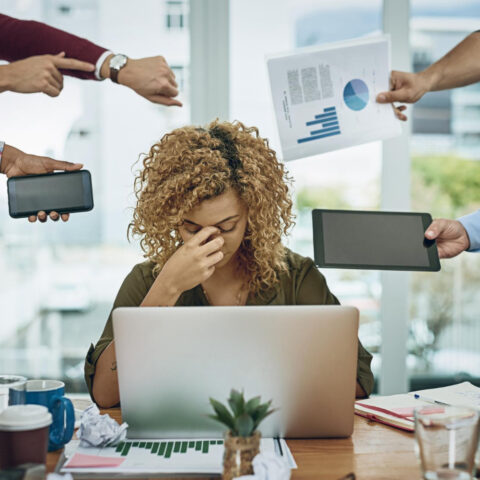 Stressed office worker finding a pathway through overwhelm strategies.