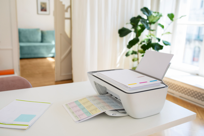 Office printer with recycled paper and eco-friendly ink cartridges