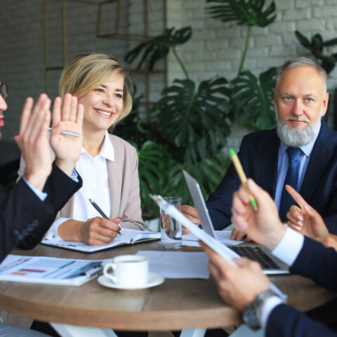 Office workers discussing the election impact