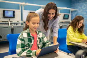 A classroom with digital tablets replacing paper, symbolising a shift to eco-friendly practices.