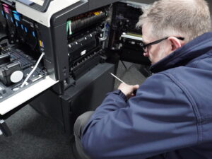 Phil Ritchie servicing a photocopier