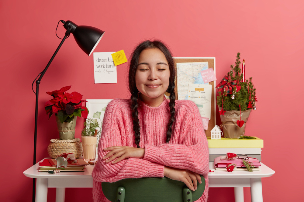 Productivity Habits and Rituals: Calm person at organised desk with free time, showing control and accomplishment.